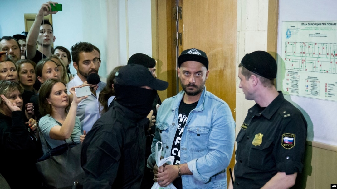 Russia's theater and film director Kirill Serebrennikov, second from right, is escorted in for hearings in a court in Moscow, Russia, Wednesday, Aug. 23, 2017. 