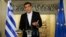 In this photo released by Greek Prime Minister's office, Greek Prime Minister Alexis Tsipras speaks during a televised address to the nation, in Athens, June 12, 2018. 