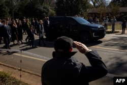 FILE - A hearse carries the casket during a procession following a funeral service for former US First Lady Rosalynn Carter, at Maranatha Baptist Church in Plains, Georgia, on November 29, 2023.