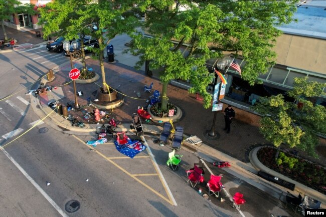 People’s belongings lie abandoned along the parade route after a mass shooting at a Fourth of July parade in the wealthy Chicago suburb of Highland Park, Illinois, U.S. July 5, 2022. (REUTERS/Cheney Orr)