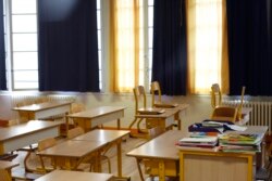 An empty classroom is seen at a closed school in Paris, March 16, 2020.