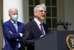 U.S. President Joe Biden listens as Attorney General Merrick Garland speaks about executive actions on gun violence prevention in the Rose Garden at the White House, April 8, 2021.