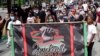 FILE - Demonstrators march through downtown Orlando, Fla., during a Juneteenth event, June 19, 2020, This year's swift approval of Juneteenth as a federal holiday sent many states hustling to figure out how to observe the event.