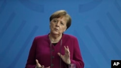 German Chancellor Angela Merkel briefs the media about measures of the German government to avoid further spread of the coronavirus at the chancellery in Berlin, Germany, Thursday, April 9, 2020.