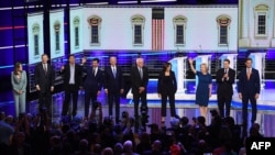 Democratic presidential hopefuls, from left, Marianne Williamson, John Hickenlooper, Andrew Yang, Pete Buttigieg, Joseph R. Biden, Bernie Sanders, Kamala Harris, Kirsten Gillibrand, Michael Bennet, and Eric Swalwell in Miami, June 27, 2019.