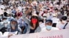 Demonstrators rally outside the Central Bank of Myanmar during a protest against the military coup and to demand the release of elected leader Aung San Suu Kyi, in Yangon, Myanmar, Feb. 11, 2021.