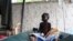 A South Sudanese child suffering from cholera sits on a bed in Juba Teaching Hospital in Juba, May 27, 2014. 