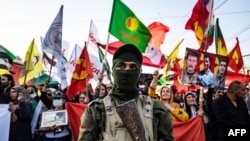 Syrian Kurds demonstrate, June 10, 2021, in the northeastern Syrian city of Qamishli against the Turkish offensive on Kurdistan Workers' Party (PKK) areas in northern Iraq.