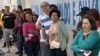 FILE - People line up to vote during the municipal elections runoff in Sao Paulo on Oct. 27, 2024. In Brazil's polarized election environment, women and minority journalists faced a disproportionate number of online and offline attacks.