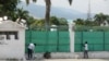 FILE - Workers paint the exterior of the National Palace in Port-au-Prince, Haiti, Sept. 23, 2024.