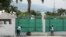 FILE - Workers paint the exterior of the National Palace in Port-au-Prince, Haiti, Sept. 23, 2024.