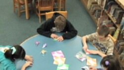 Students making paper cranes at Somerville Elementary School in Ridgewood, New Jersey