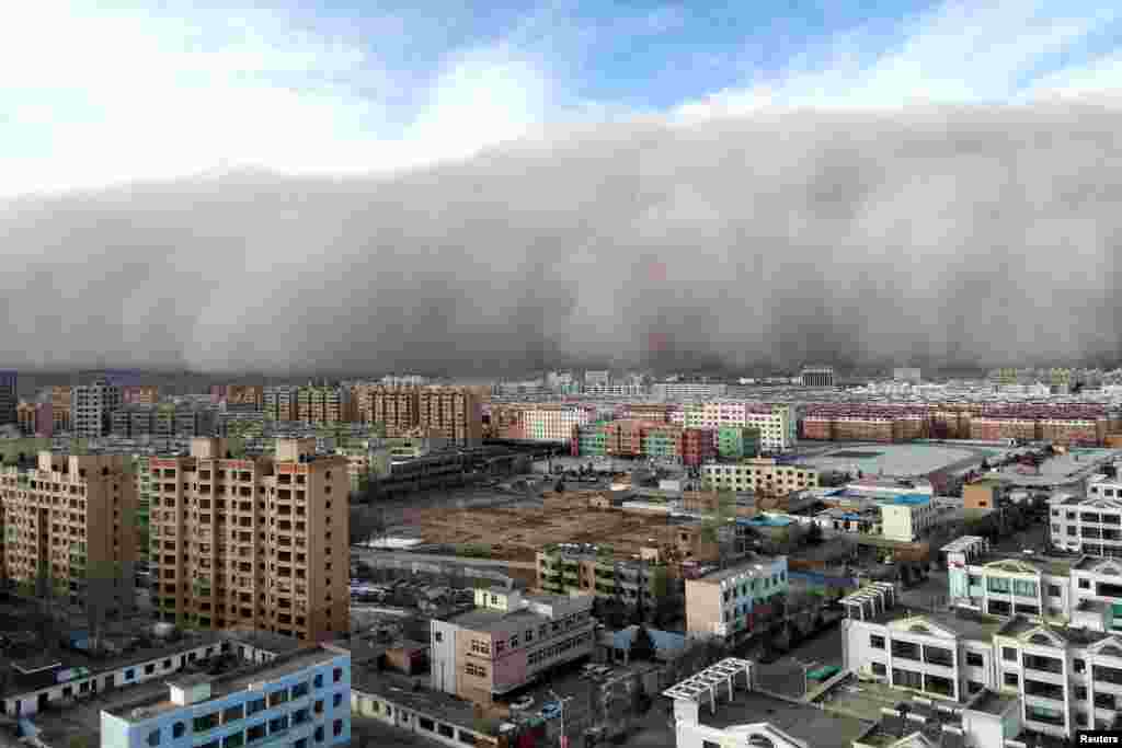 A sandstorm hits the city of Zhangye in Gansu province, China, Nov. 25, 2018.