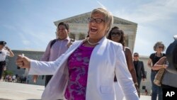 Amy Hagstrom Miller, founder of Whole Woman's Health, a Texas women's health clinic that provides abortions, rejoices as she leaves the Supreme Court in Washington, June 27, 2016, as the justices struck down the Texas anti-abortion law known as HB2.