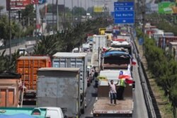 Vehicles block the road during a demonstration against toll charges, on the outskirts of Santiago, Chile, Nov. 6, 2019.