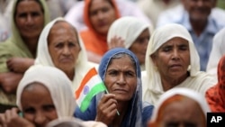 Hindus who migrated from Pakistan to Jammu in 1947 participate in a protest demanding citizenship rights in Jammu, India, Sept. 8, 2012. 