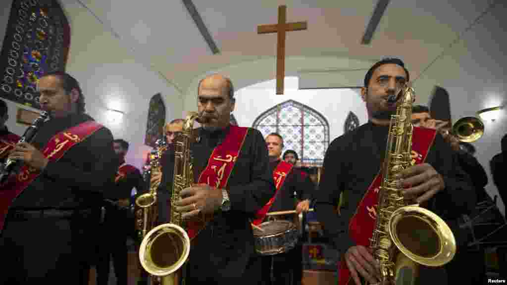 A musical band from Shi'ites community in Bahrain perform at St. Christopher's Cathedral during Christmas Mass in Manama, Bahrain Dec. 25, 2015. 