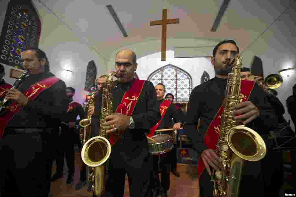 A musical band from Shi&#39;ites community in Bahrain perform at St. Christopher&#39;s Cathedral during Christmas Mass in Manama, Bahrain.