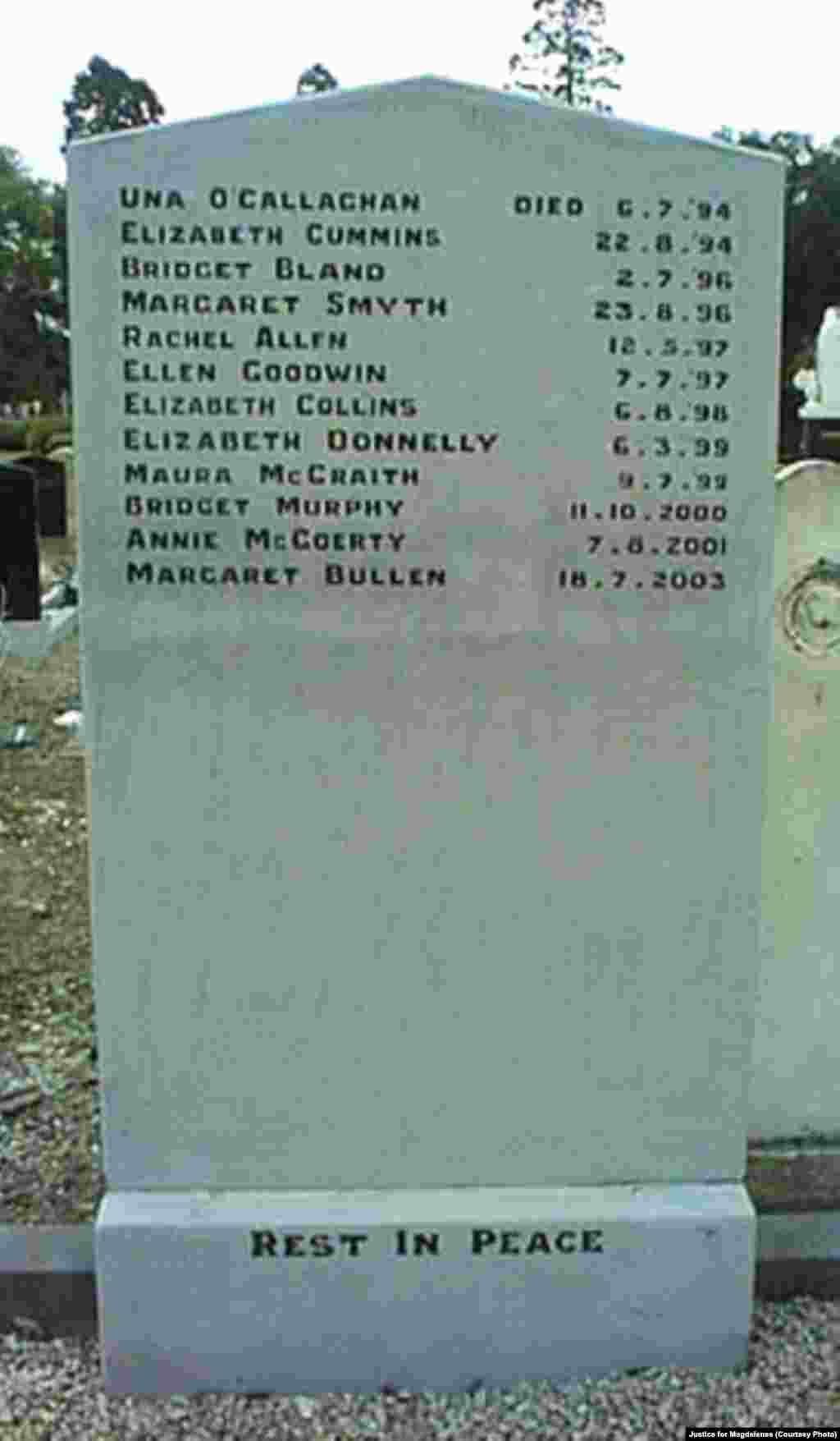 Katie Bender gets some assistance from Johanna Bender (L) as they dump water from a boot while sitting on a flooded street after Hurricane Arthur passed through in Manteo, N.C.