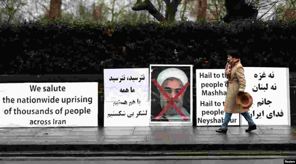 Opponents of Iranian President Hassan Rouhani hold a protest outside the Iranian embassy in west London, Britain, Jan. 2, 2018.