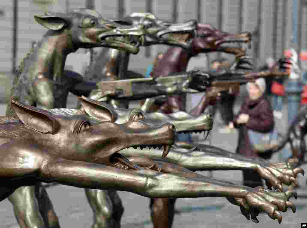 Sculptures by artist Rainer Opolka are on display at the Neumarkt market square in Dresden, eastern Germany. The 66 life-sized metal wolf sculptures are part of the exhibition &#39;The wolves are back&#39;, focusing on the hazards of xenophobia, hate and right-wing extremism.