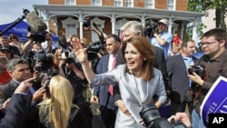 Representative Michele Bachmann, Republican from Minnesota, waves to supporters after making her formal announcement to seek the 2012 Republican presidential nomination in Waterloo, Iowa, June 27, 2011