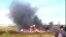 In this image made video, smoke rises from a crash side of a Russian helicopter Mi-8 crashed shortly after takeoff in Vankor, above the Arctic Circle in Siberia, Russia, Saturday, Aug. 4, 2018. 