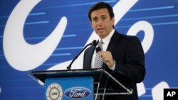 Ford President and CEO Mark Fields addresses the Flat Rock Assembly Tuesday, in Flat Rock, Michigan. Ford is canceling plans to build a new $1.6 billion factory in Mexico and will invest $700 million in a Michigan plant.