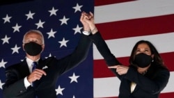 Former vice-president and Democratic presidential nominee Joe Biden (L) and Senator from California and Democratic vice presidential nominee Kamala Harris greet supporters outside the Chase Center in Wilmington, Delaware, at the conclusion of the…