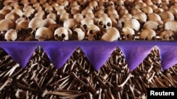 The skulls and bones of Rwandan victims rest on shelves at a genocide memorial inside the church at Ntarama just outside the capital Kigali, August 6, 2010.