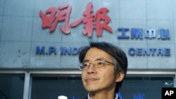 Former Ming Pao chief editor Ken Lau is pictured outside his office in Hong Kong on Jan. 31, 2014.