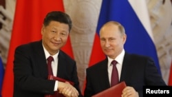 Vladimir Putin meets Xi Jinping