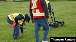 A crew performs a ground-penetrating radar search of a field where the Cowessess First Nation said they had found 751 unmarked graves, near the former Marieval Indian Residential School in Grayson, Saskatchewan, Canada, June 18, 2021.