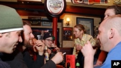 University students enjoy a few beers at a pub in Cambridge, Mass. in this file photo.