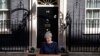Britain's Prime Minister Theresa May speaks to the media outside her official residence of 10 Downing Street in London, April 18, 2017. 