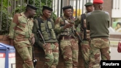 FILE: Soldiers are seen on the street in central Harare, Zimbabwe, Nov. 16, 2017. 