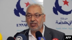 FILE: Tunisian al Nahda party's leader, Rached al Ghannouchi speaks during a press conference in Tunis. Taken 5.13.2013