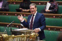 In this handout photo provided by UK Parliament, Labour Party leader Keir Starmer speaks during Prime Minister's Questions at the House of Commons, London, June 9, 2021.