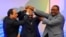 Sudanese President Omar al-Bashir, (c), Egyptian President Abdel-Fattah el-Sissi, (l), and Ethiopian Prime Minister Hailemariam Desalegn, (r), hold hands after signing an agreement on sharing water from the Nile River, in Khartoum, Sudan, March 23, 2015. 