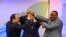 FILE - Sudanese President Omar al-Bashir, (c), Egyptian President Abdel-Fattah el-Sissi, (l), and Ethiopian Prime Minister Hailemariam Desalegn, (r), hold hands after signing an agreement on sharing water from the Nile River, in Khartoum, Sudan, March 23, 2015. 
