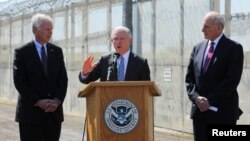 U.S. Attorney General Jeff Sessions speaks as Secretary of Homeland Security John Kelly, right, and U.S. Senator Ron Johnson look on while visiting the U.S.-Mexico border area in San Diego, California, April 21, 2017.