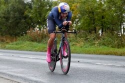 FILE - In this Sept. 24, 2019, file photo, Chloe Dygert, of the United States, competes in the women's elite individual time trial event at the road cycling World Championships in Harrogate, England. (AP Photo/Manu Fernandez, File)