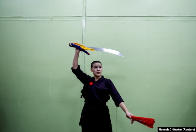 A Kung Fu nun practises as she waits for her performance at Druk Amitabha Mountain Nunnery in Kathmandu, Nepal December 30, 2024.