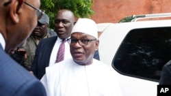 FILE - Malian incumbent President, Ibrahim Boubacar Keita, arrives to cast his ballot during the Presidential second round election in Bamako, Mali.