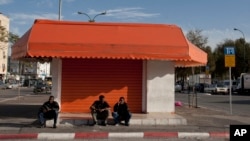 African migrants sit in a street in southern Tel Aviv, Israel, Jan. 10, 2012.