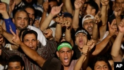 Supporters of ousted Egypt's President Mohammed Morsi shout slogans during a demonstration after the Iftar prayer, evening meal when Muslims break their fast during the Islamic month of Ramadan, in Nasr City, Cairo, Egypt, July 10, 2013.