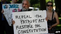 Protesters rally outside the U.S. Capitol against the NSA's recently detailed surveillance programs in Washington, D.C., June 13, 2013.