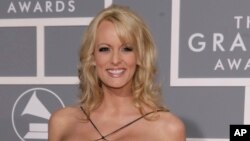FILE -Stephanie Clifford, known as Stormy Daniels, arrives for the 49th Annual Grammy Awards in Los Angeles, Feb. 11, 2007. 