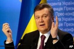 FILE - Then-Ukrainian president Viktor Yanukovych speaks during a press conference in Kyiv, Ukraine, March 1, 2013.