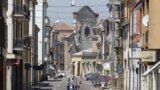 A semi-collapsed church is seen as people leave their homes in Mirandola, northern Italy, May 29, 2012.